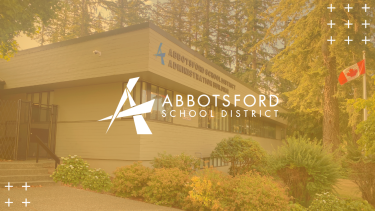 Abbotsford School Board Office with gold overlay and logo in the middle of image