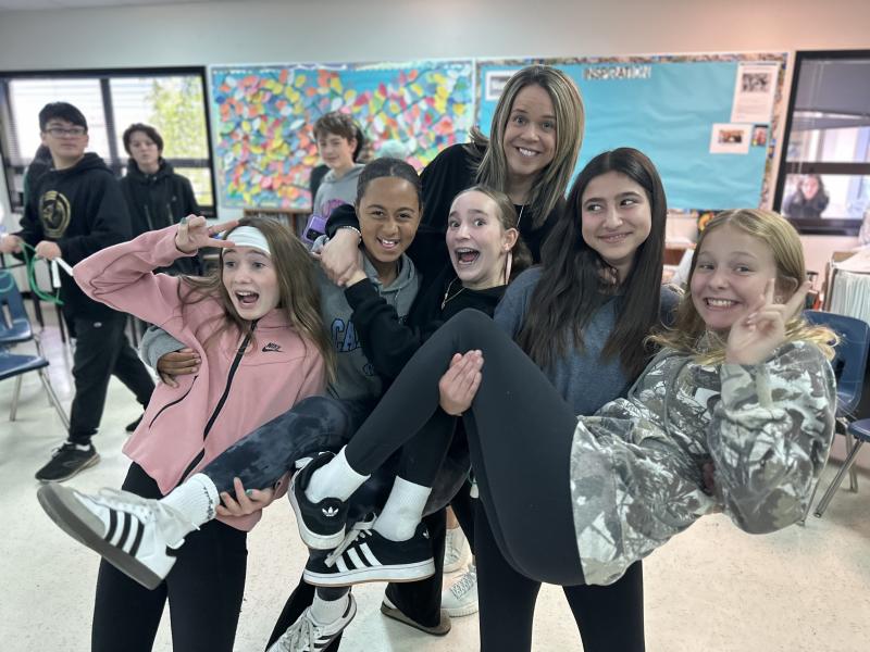 Grade 8 Teacher Madame Josee Perron with students.