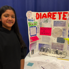 Student displays her work on diabetes.
