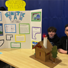 Students display science project for a kinetic fan.