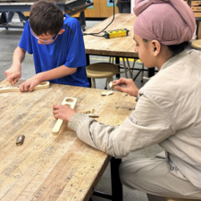 Students design a device to build tool to measure how much spaghetti is needed to feed a certain number of people