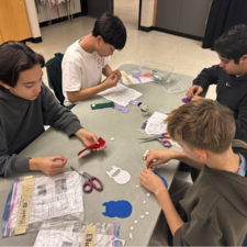 Students working in a group on their sewing projects